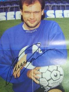 Manchester City star Uwe Rossler sigend magazine picture