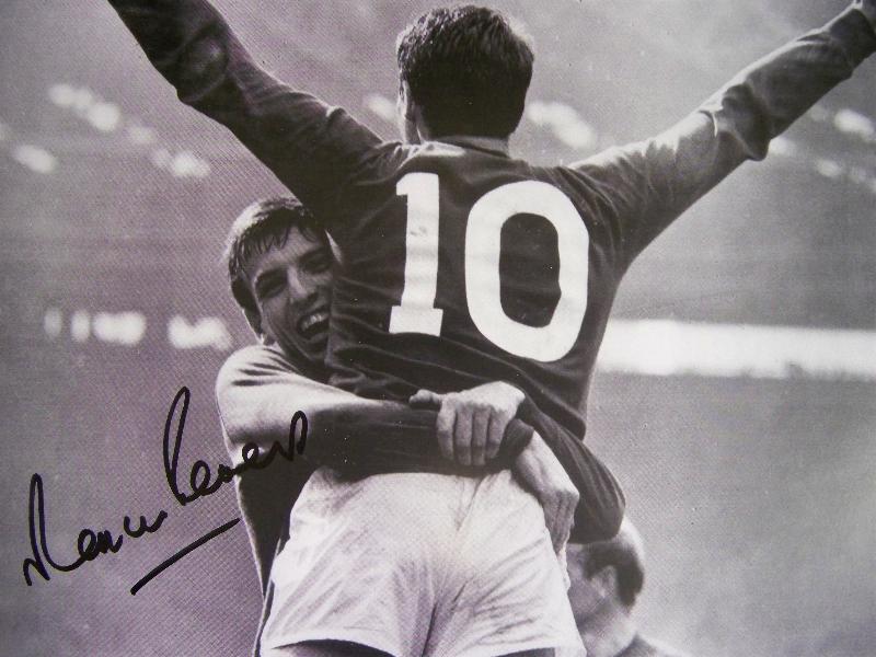 Martin Peters cuddling Geoff Hurst signed by Martin 