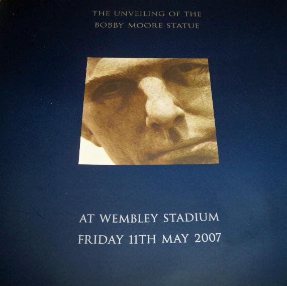 Programme for the unveiling of the Bobby Moore Statue at Wembley now with invite for Sir Geoff Hurst