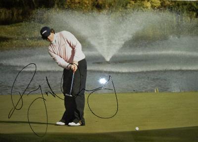 Rory McIlroy signed  action photo