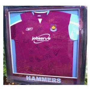 Framed and signed West Ham shirt.
