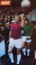 Bobby Moore (signed image) leads out West Ham at Upton Park