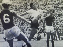 Bobby Moore in World Cup action from magazine signed