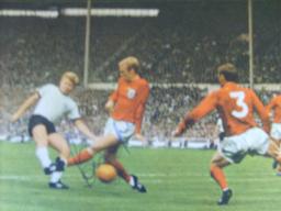 Bobby Moore in 1966 action signed magazine picture