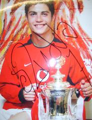 Christiano Ronaldo poses with the FA Cup