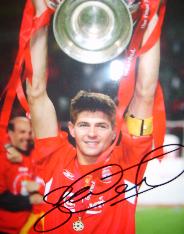Liverpool skipper Steve Gerrard holds aloft the Champions League trophy from last time they won