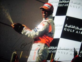 Lewis Hamilton celebrates signed photo